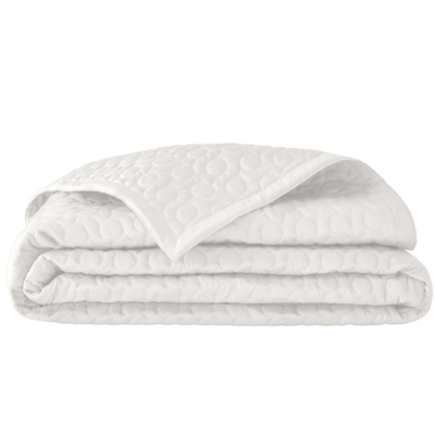 witte bedsprei opgevouwen